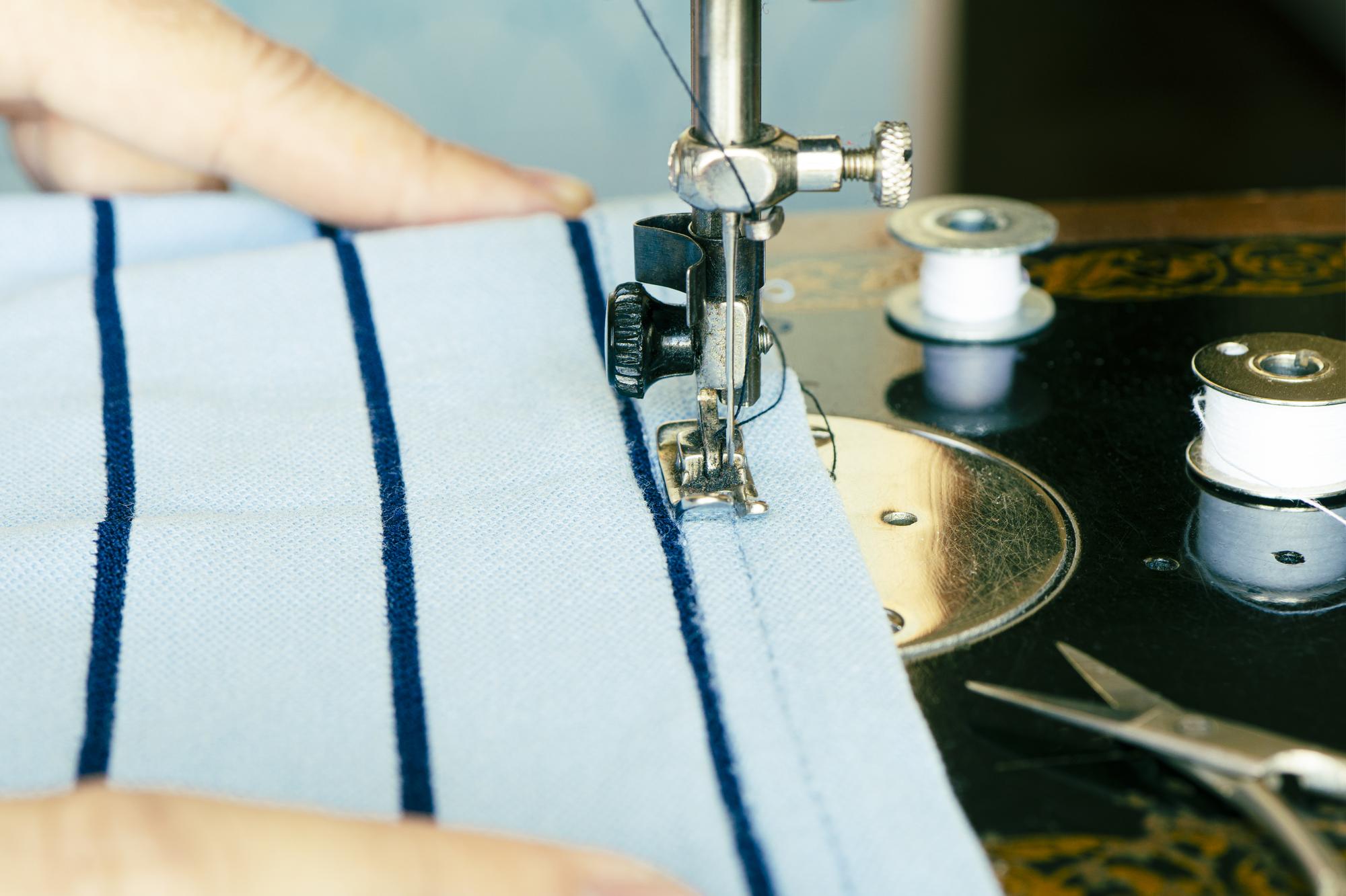 Close-up machine satin stitch monogram on shirt cuff